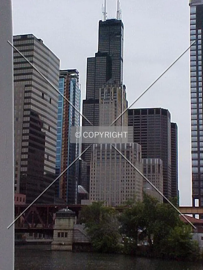 UBS Tower mixed in with the Sears Tower and Civic Opera Building