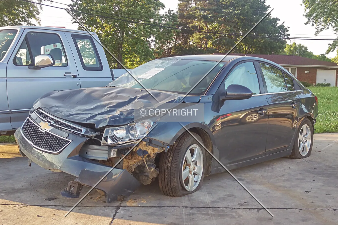 A wrecked Chevrolet Cruze sold at the auto auction; June 20, 2015