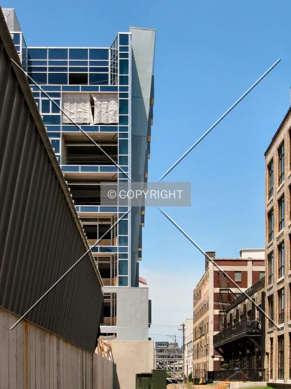 Leaning toward the neighboring Bookmen Lofts, from the driveway next to the garage entrance