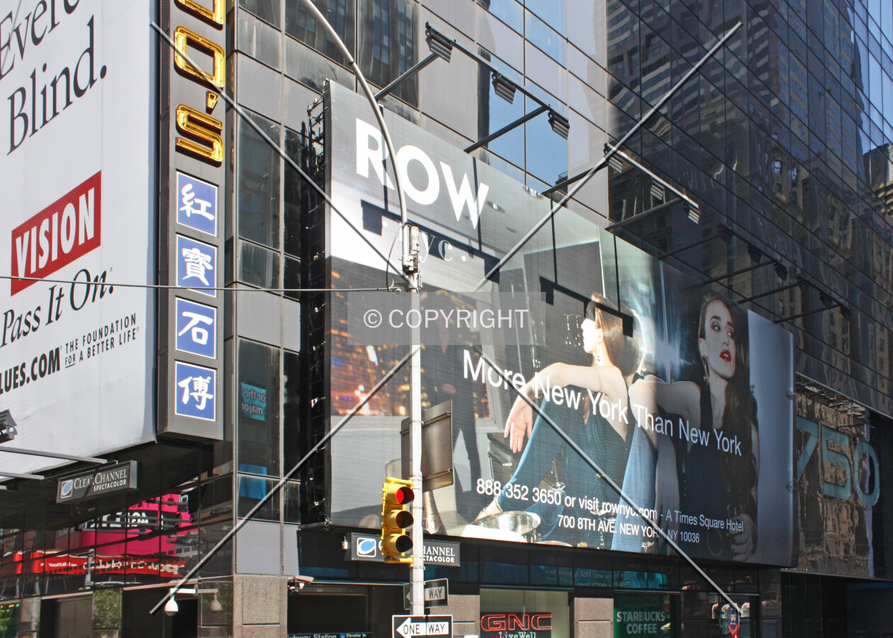 Advertisements at the base from across 7th Avenue