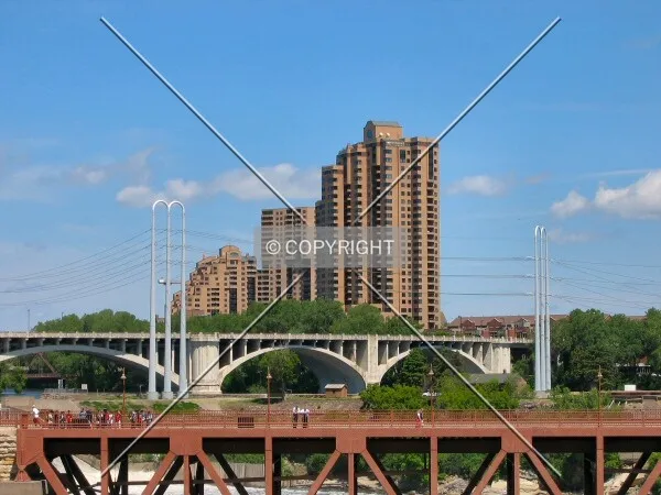 View to the north from West River Road over Stone Arch Bridge and 3rd Avenue Bridge