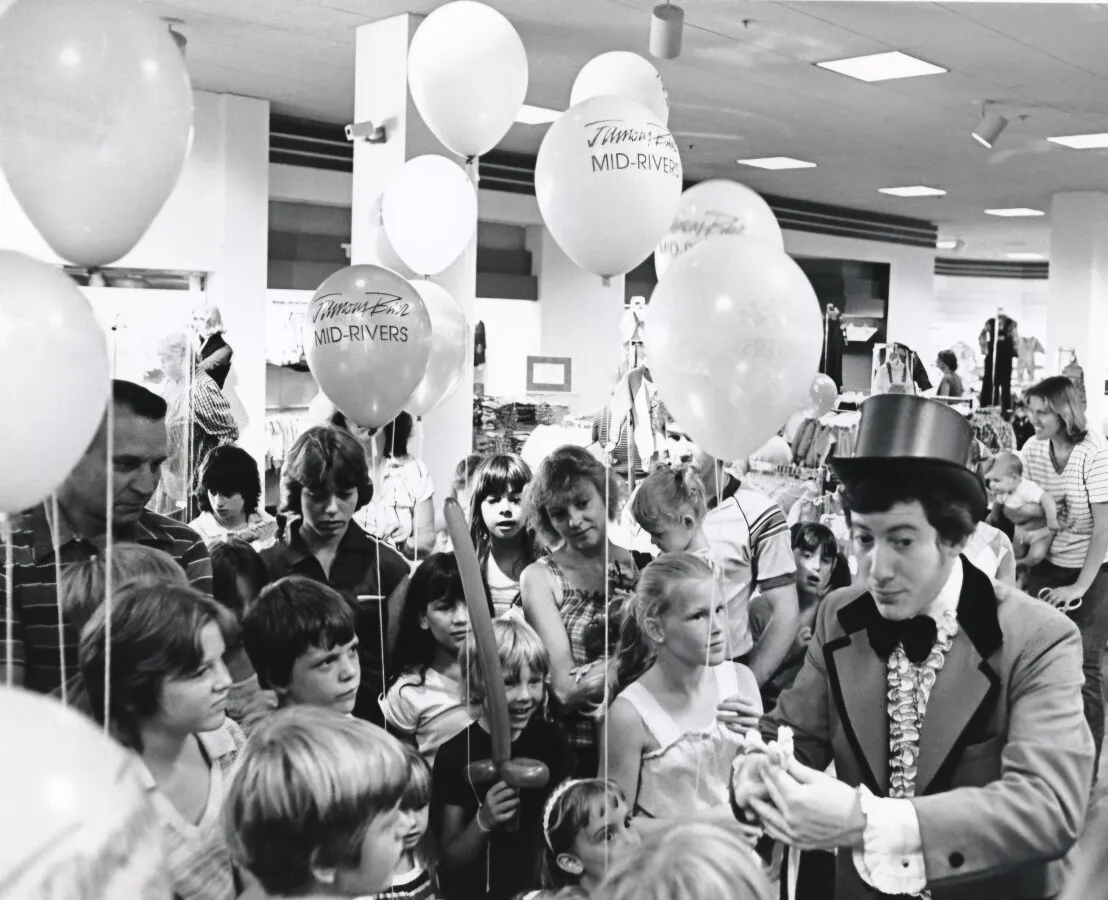 Children being entertained at the grand opening of the Famous-Barr department store at Mid-Rivers Mall, 1981