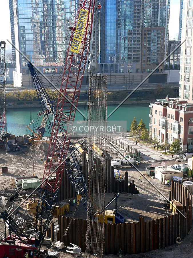 Preparing to lower a rebar cage into position as seen from the 13th floor of the North Pier Tower parking garage