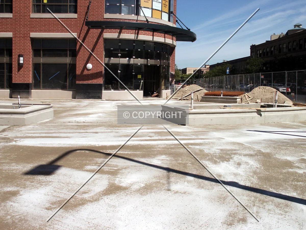 Small sidewalk plaza by the southeast corner