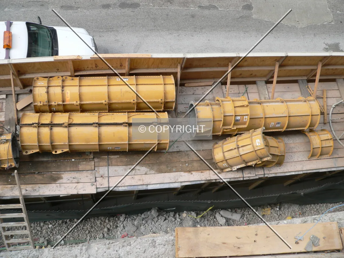Formwork being stored on top of the protective barricade