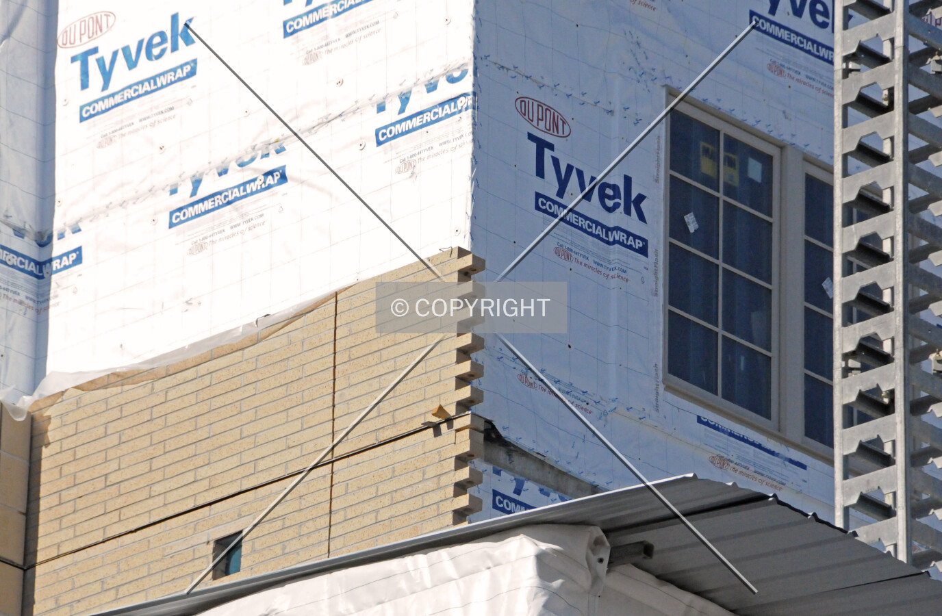Masonry being applied to the southeast corner
