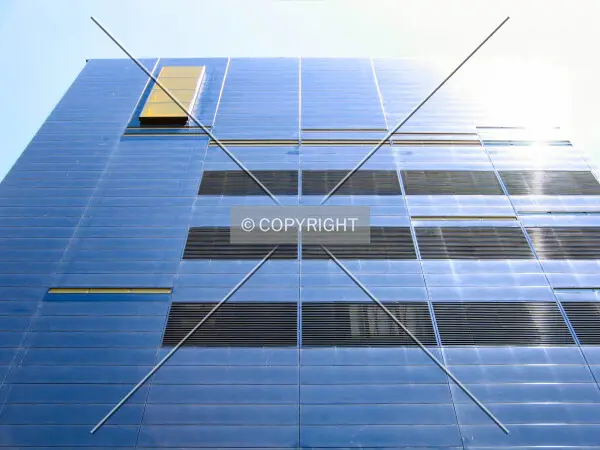 Looking up from 2nd Street South, blue steel reflecting the bright summer sun