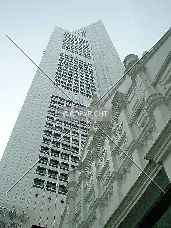 View up from the east with the entrance of Raffles Place MRT Station in the foreground