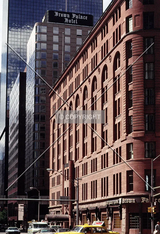 Vintage view from the southeast along 17th Street showing the former Brown Palace Hotel sign at the top