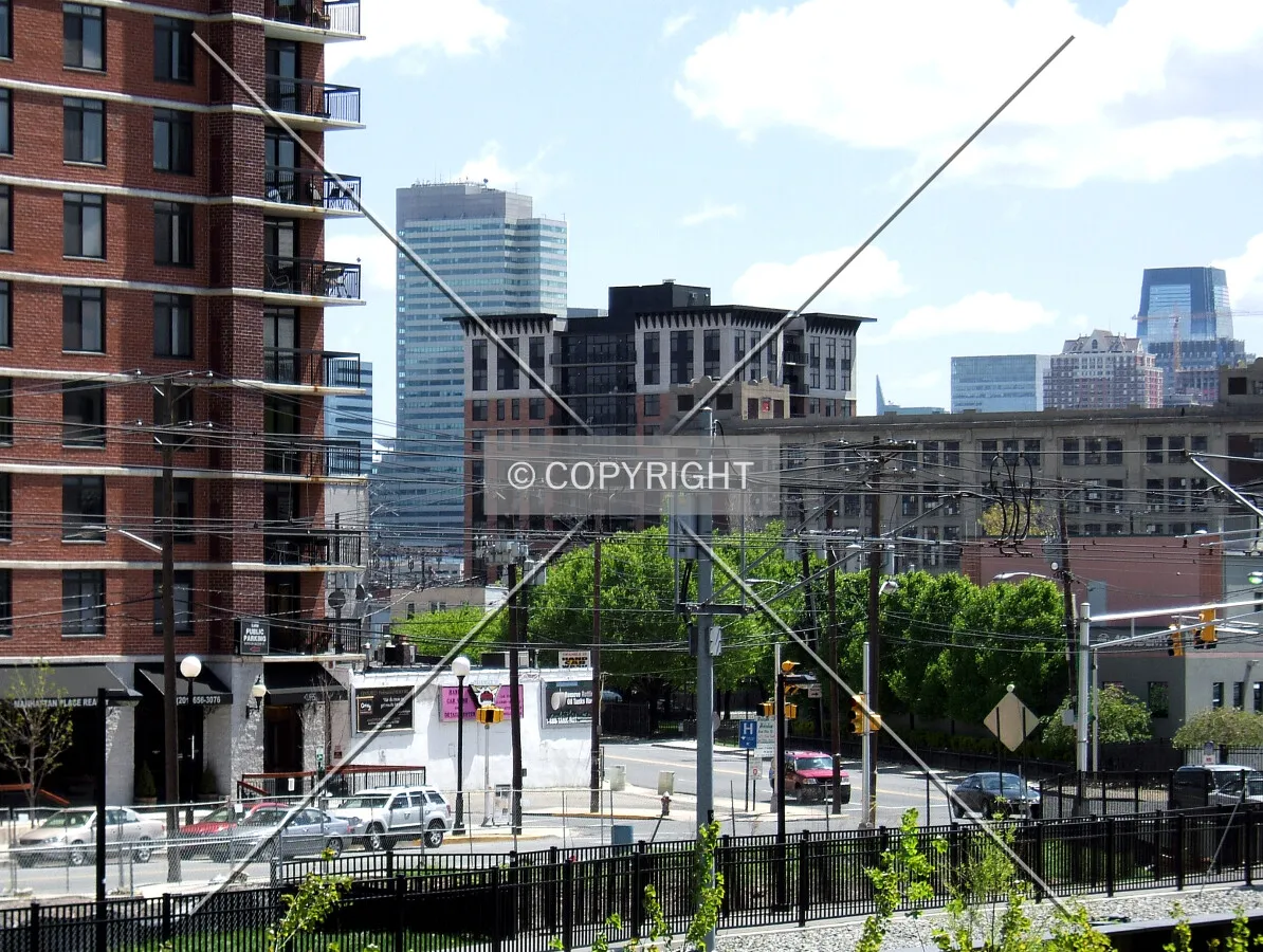 View from the northwest past the Sky Club with Jersey City in the background