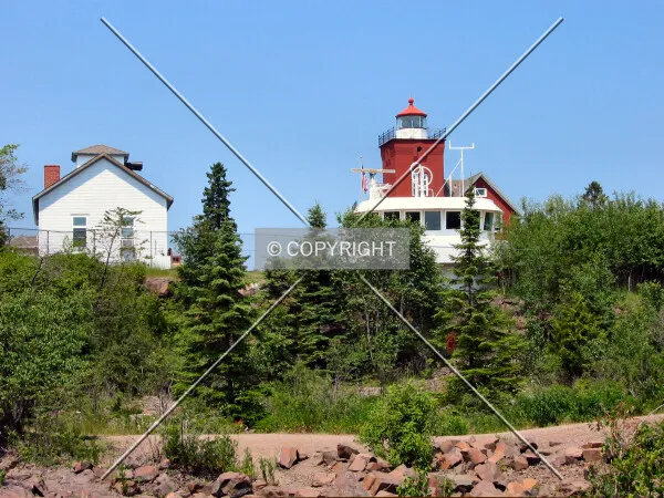 Rising over a rocky Lake Superior shore