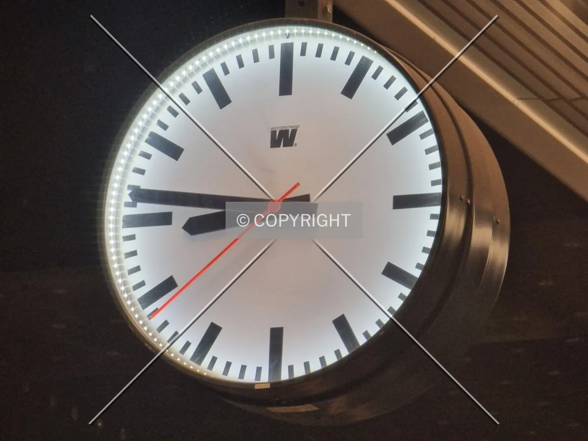 Analog clock at a train station