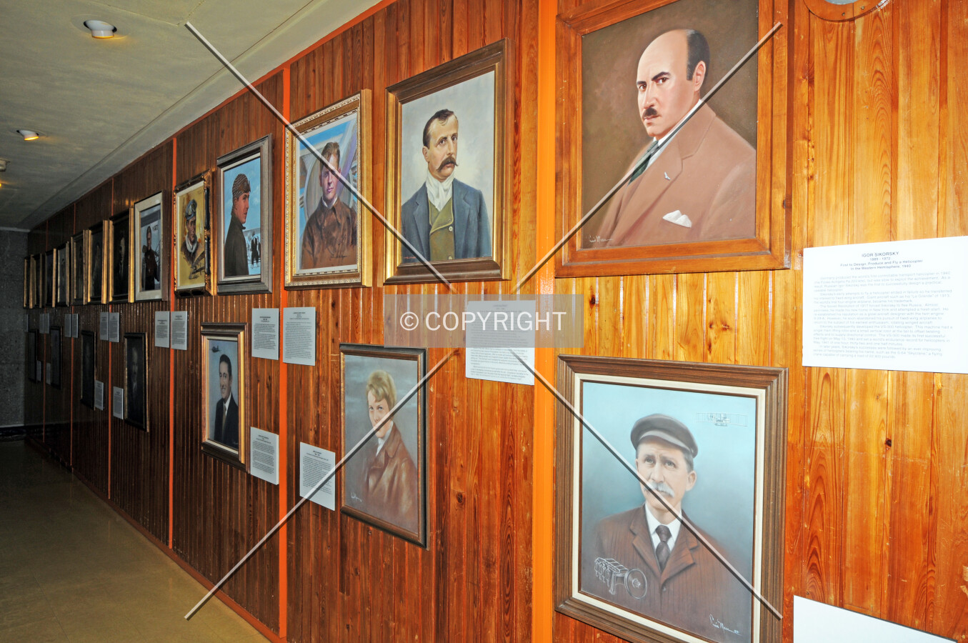 View of the Flight Room wall with portraits of famous aviators of the past