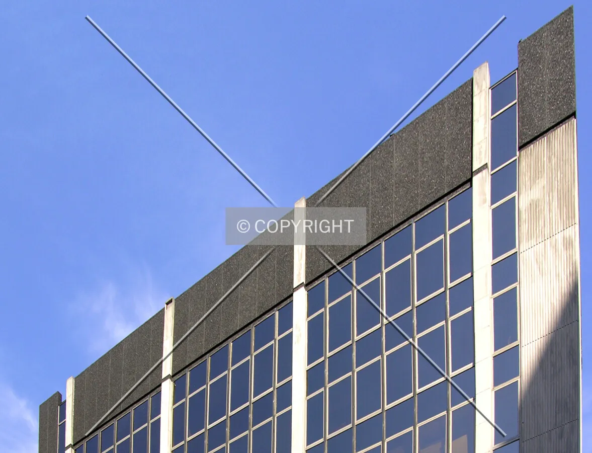 Top facade detail from the southwest