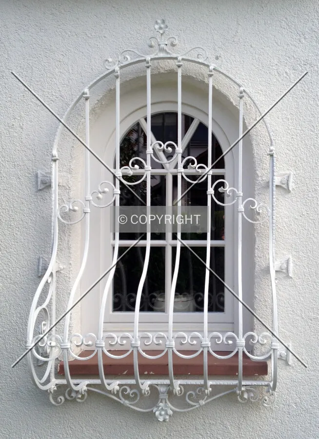 A grilled lattice window which makes it impossible for burglars to break into the house