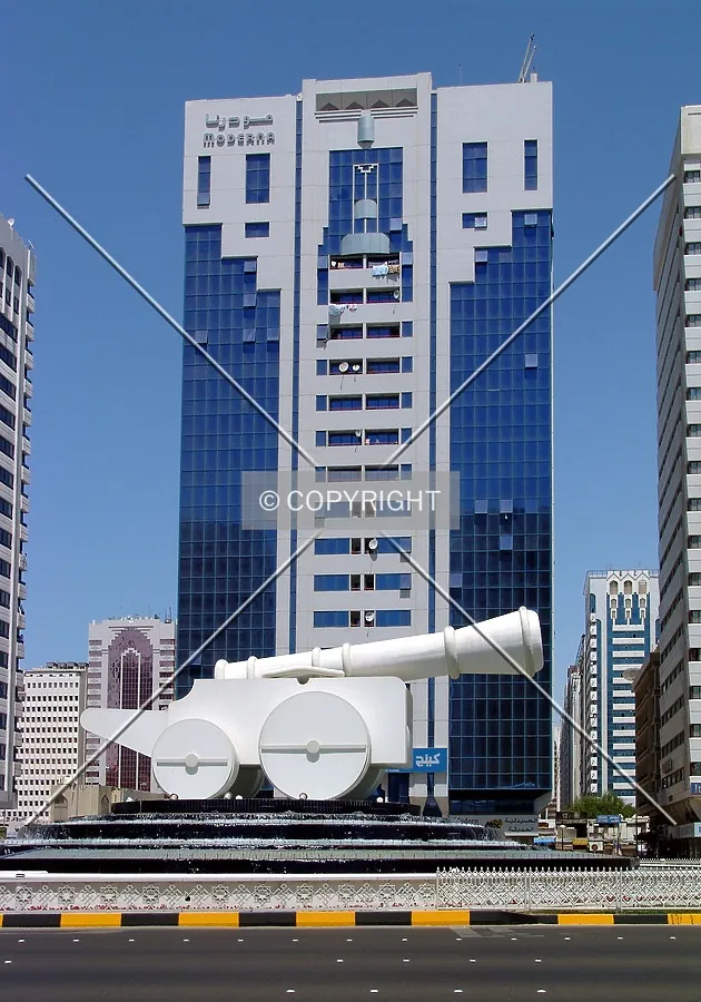 With cannon statue