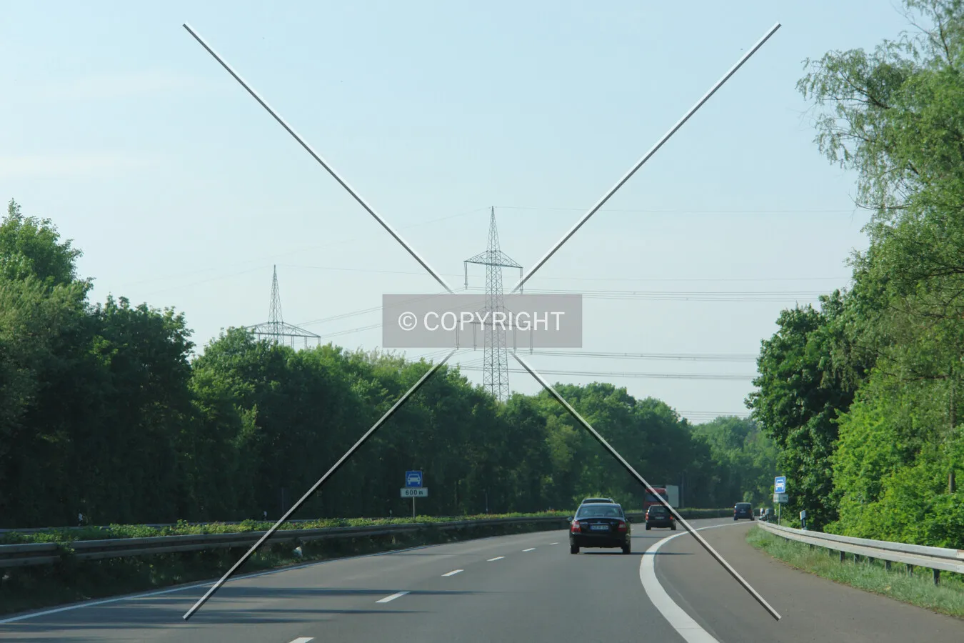Power poles crossing a highway