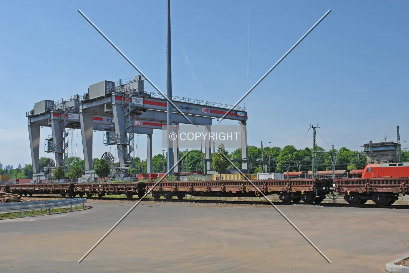 A container rail terminal including containers and heavy cranes