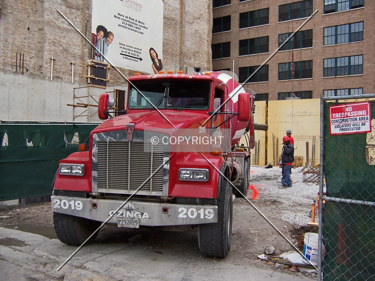 An Ozigna Concrete truck making a delivery to the site