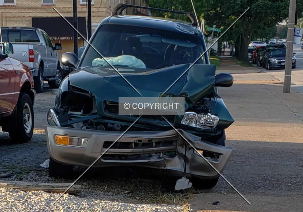 A wrecked vehicle sitting out front; July 15, 2018