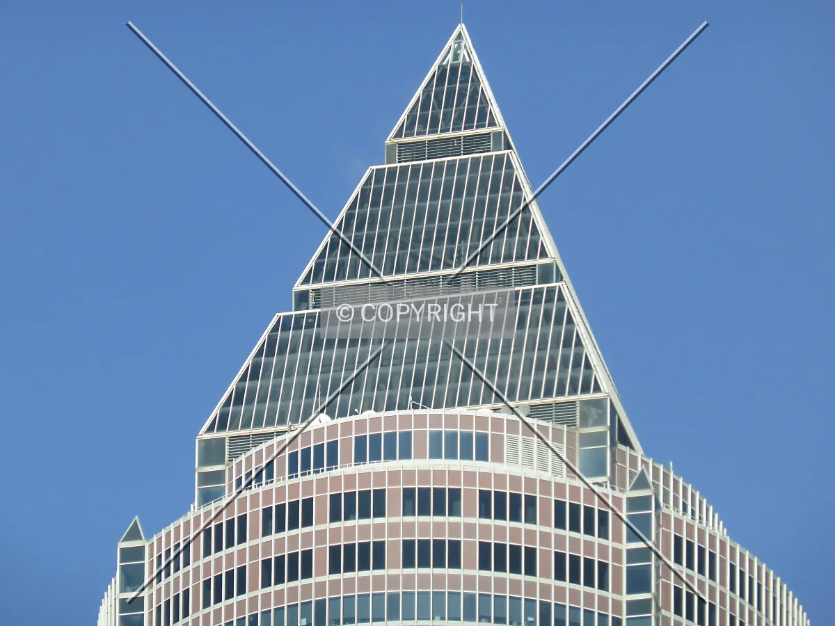 The pyramid sits ontop of the skyscraper giving it its majestetic appearance