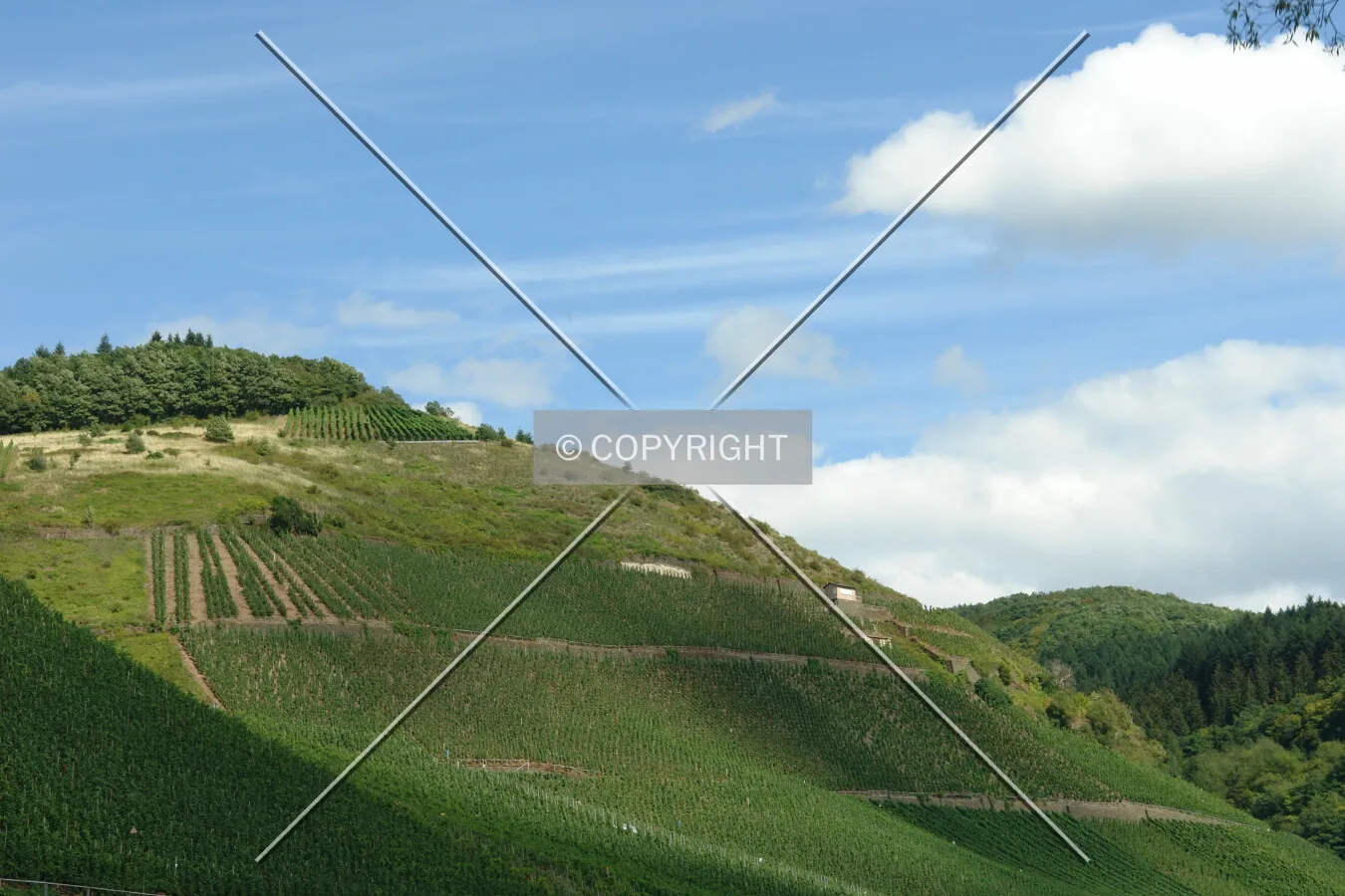 Clouds and blue sky above a hill