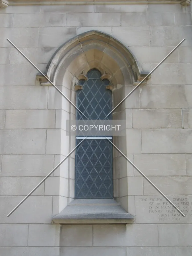 Gothic window adjacent the main doors