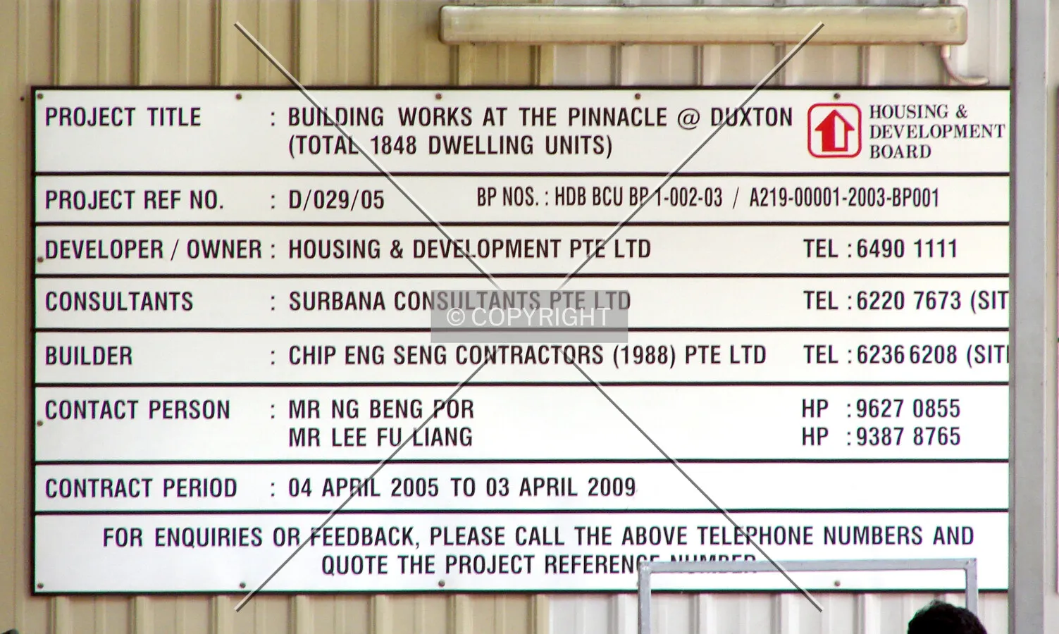 Project information displayed on construction site fence