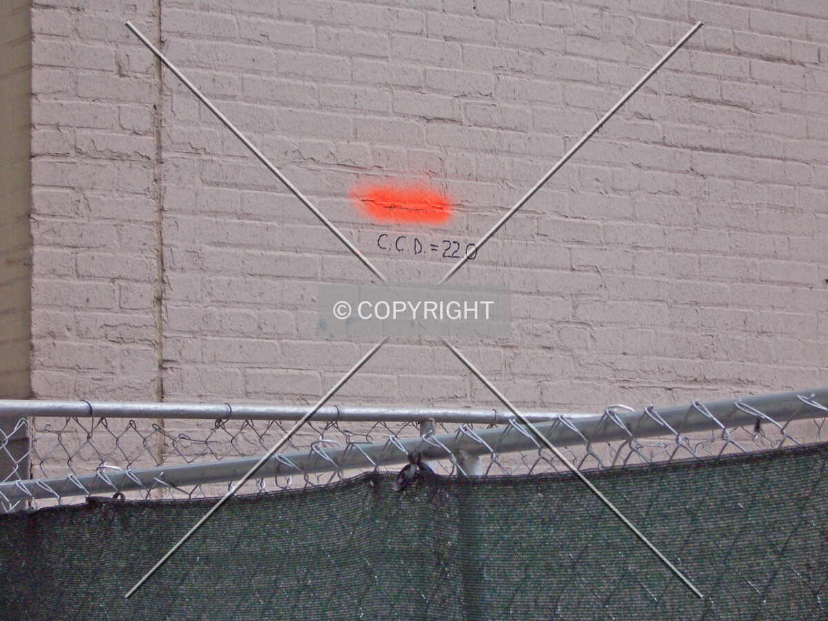 A spot elevation on the east wall of the LaSalle-Wacker Building which marks 22 feet above Chicago City Datum