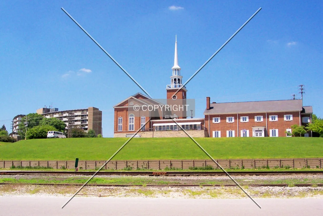 Looking west from the riverfront towards the Mississippi Terrace Apartments and the United Presbyterian Church