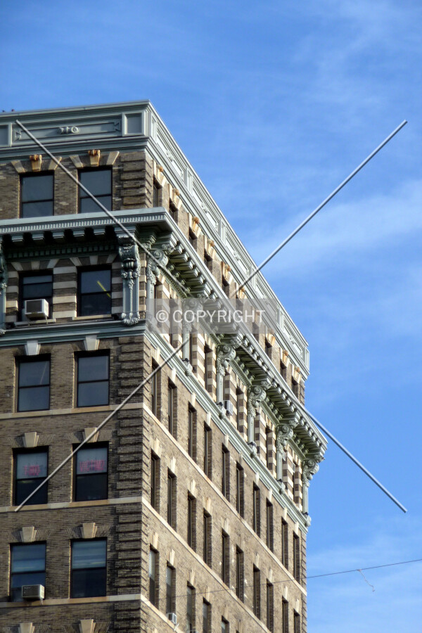 Southwest corner at the upper stories