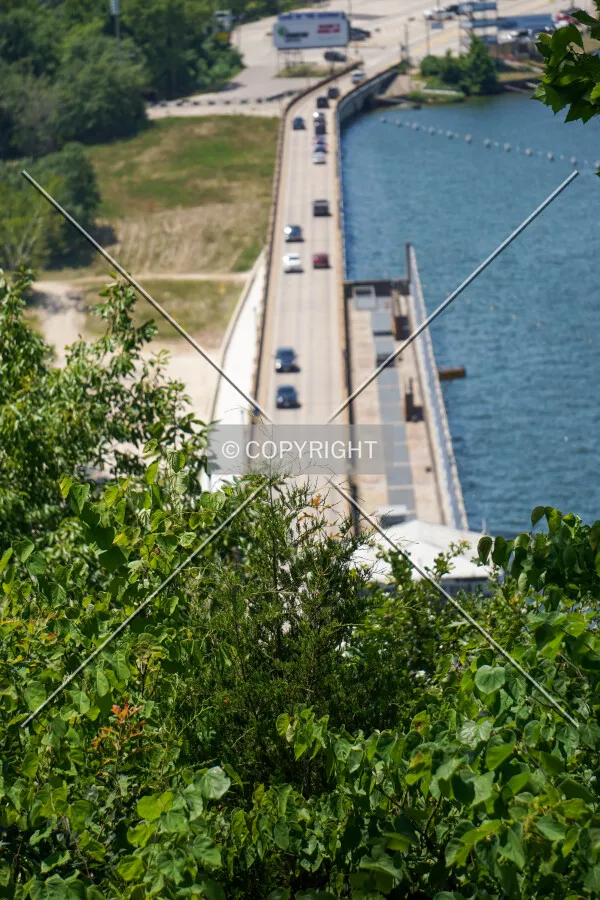 Distant view behind trees next to the lookout platform to the northeast; July 11, 2020
