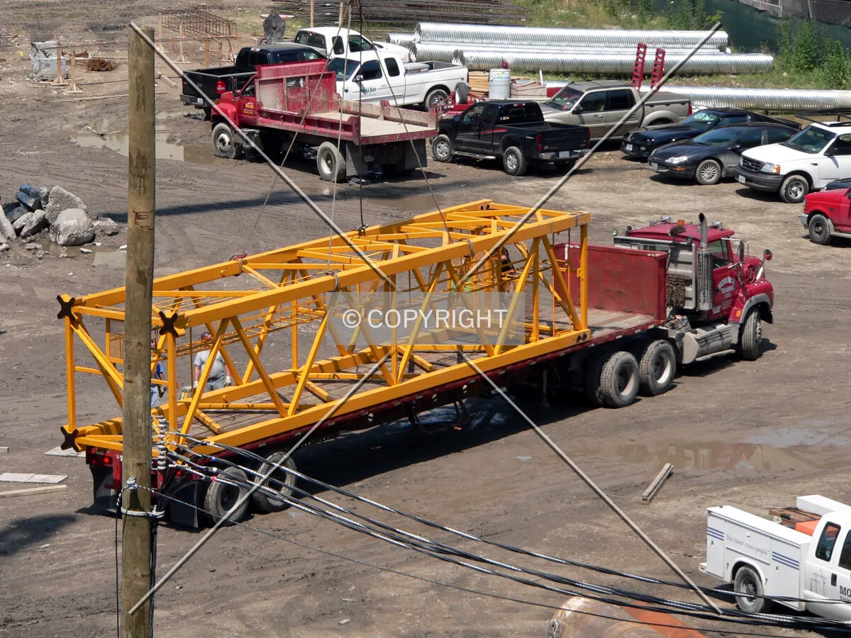 Section of tower crane on a flatbed truck