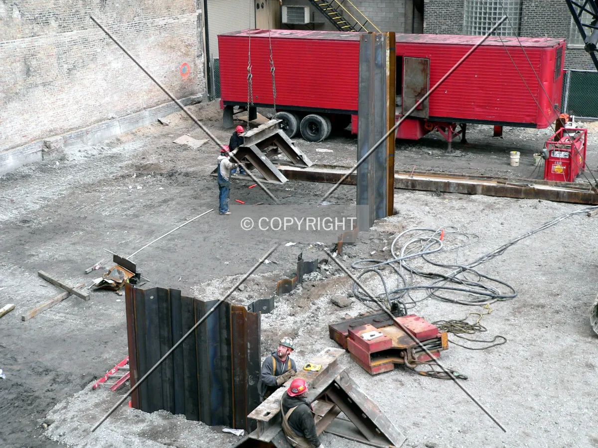 Steel sheeting being driven into the ground