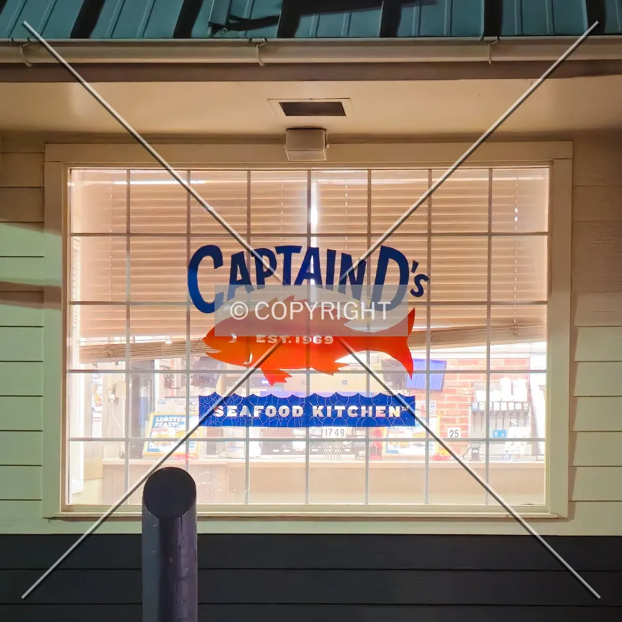 Logo in the window at night; October 28, 2014