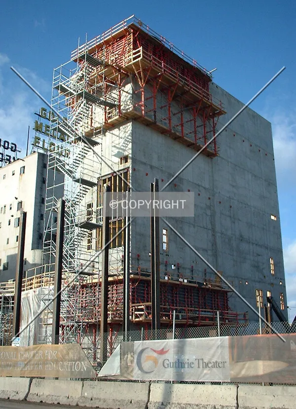 Concrete rising at the center of the site, from 2nd Street