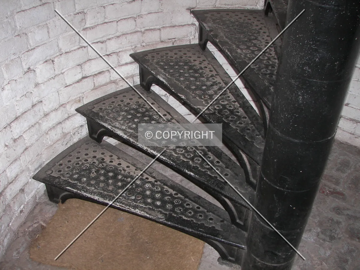 Looking at the first steps of the cast iron staircase