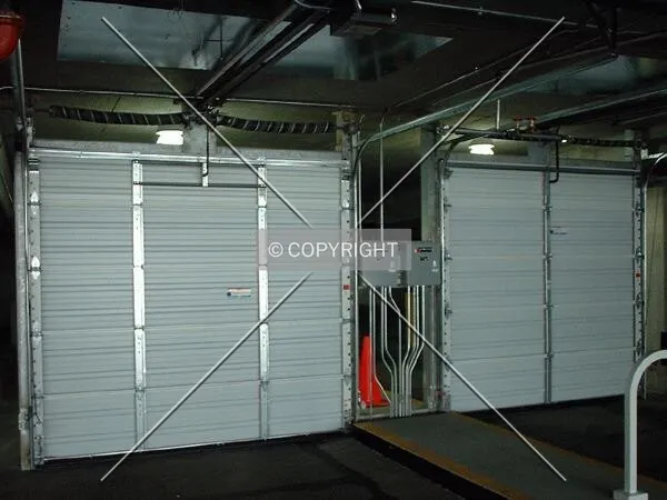 Garage doors separating public from resident parking