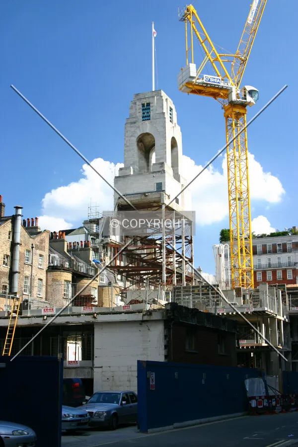 View south of the rear showing the retained clock tower seemingly suspended above the site