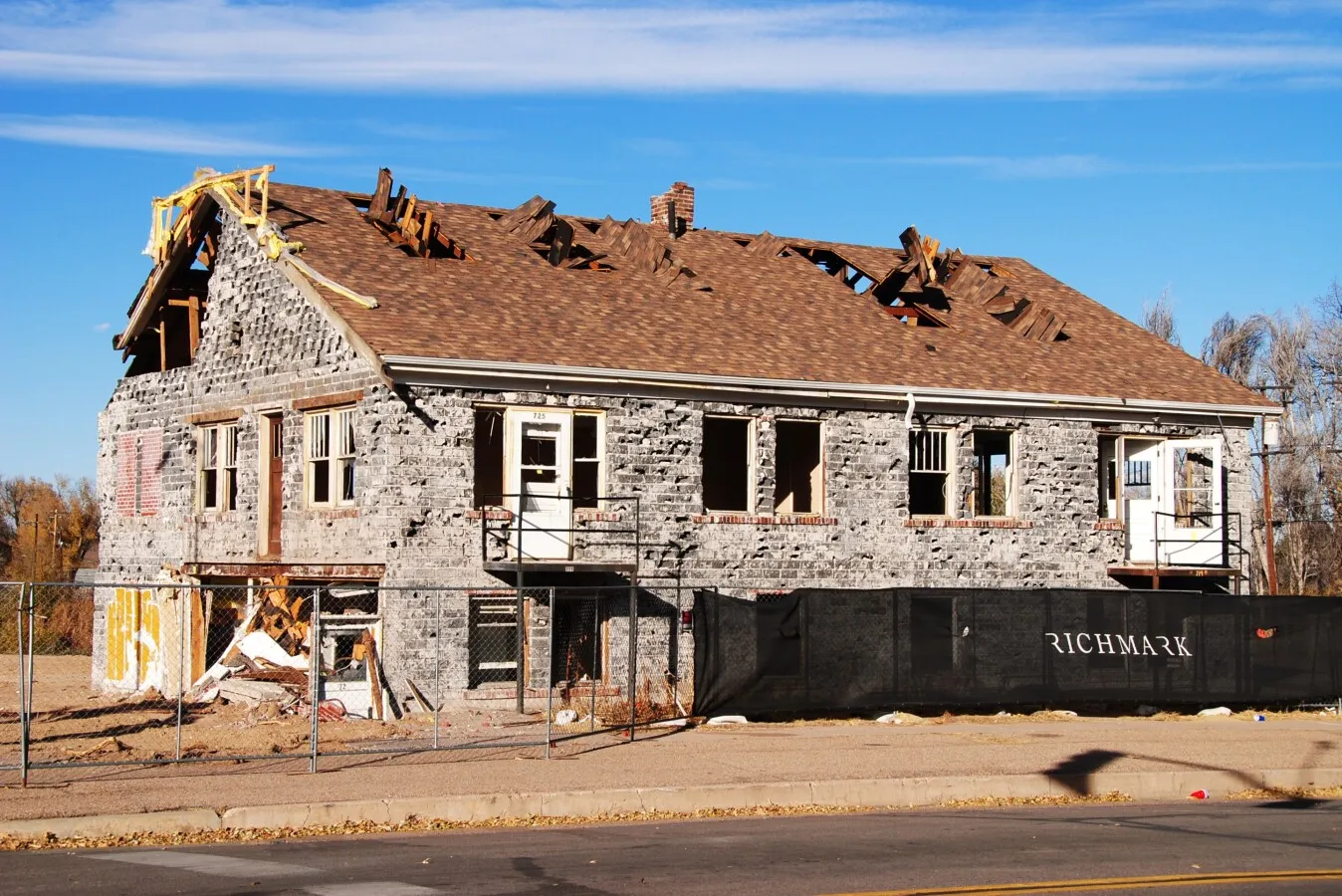 Looking northeast at an abandoned building awaiting demolition