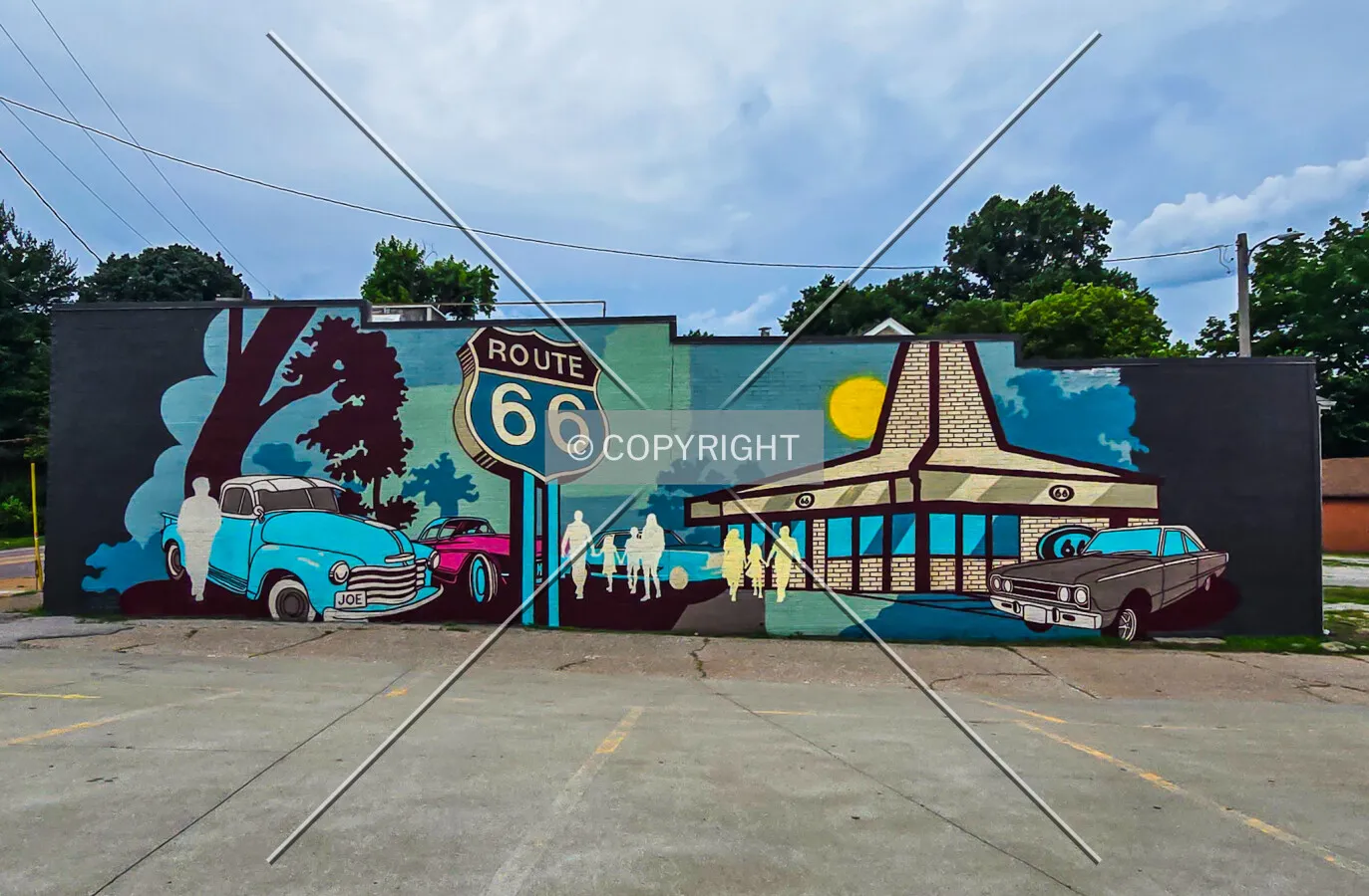 A newly installed mural in progress on the east facade, Saturday, June 13, 2026