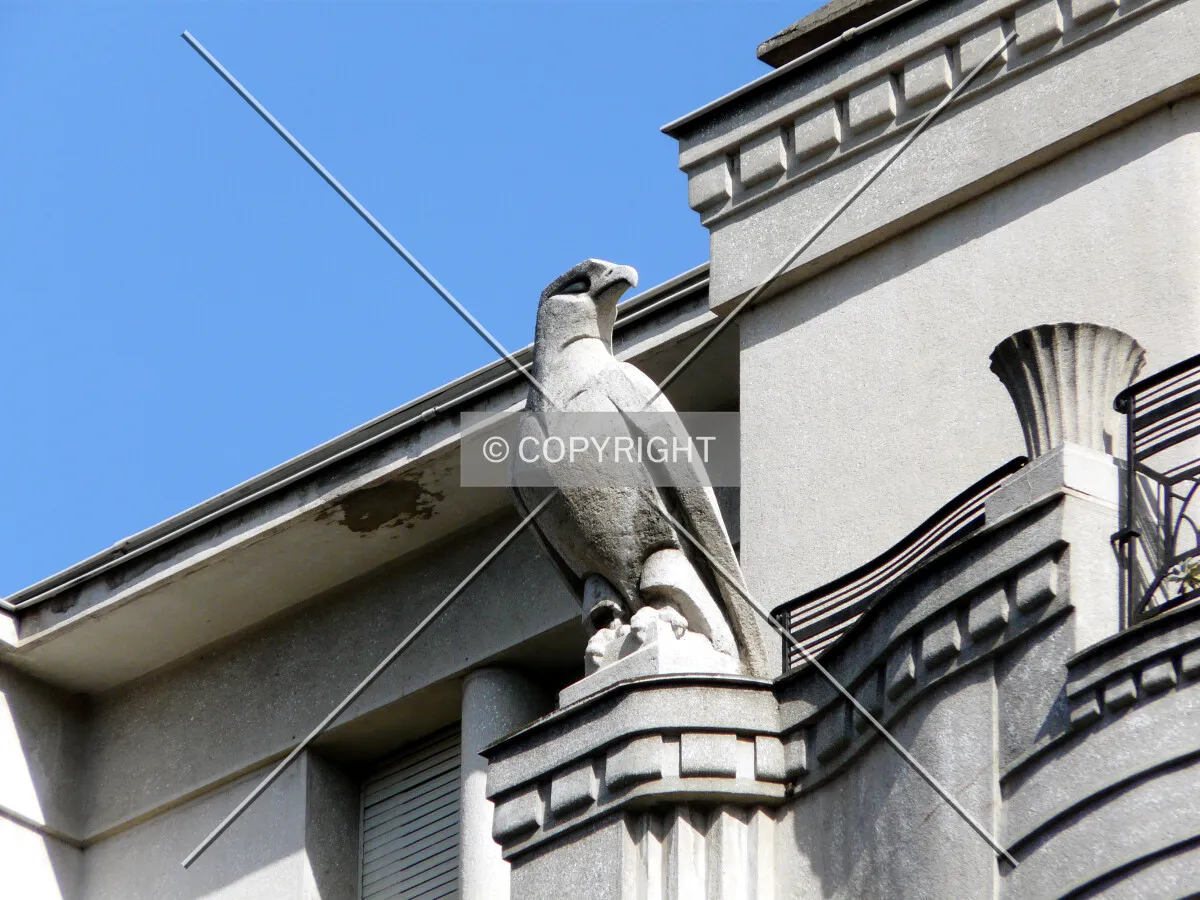 Stone statue on top, near the corner