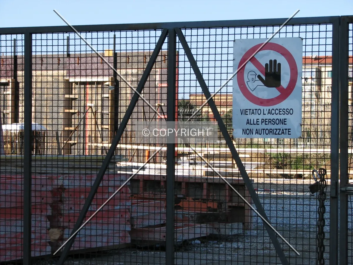 The yard gate with excavation site in the background