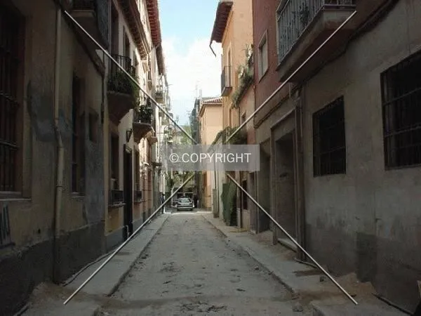 Typical narrow street of Granada