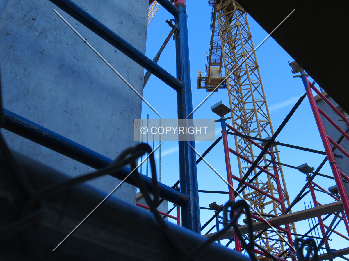 Looking up the tower crane from the Marquette Avenue sidewalk
