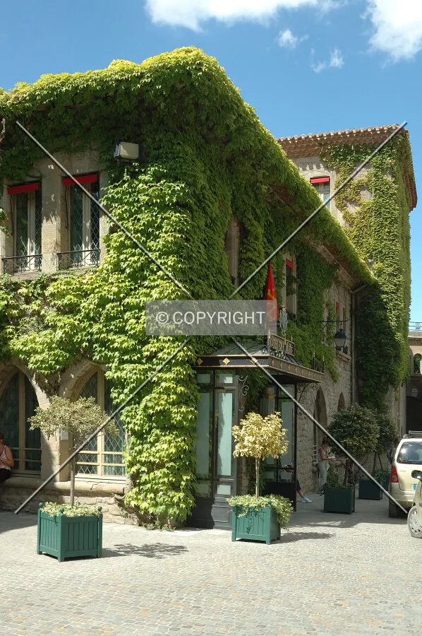Hotel with plants all over the facade