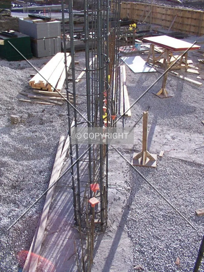 Column reinforcements rising out of the foundation