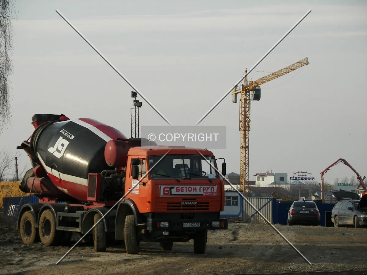Concrete mixer near the construction site
