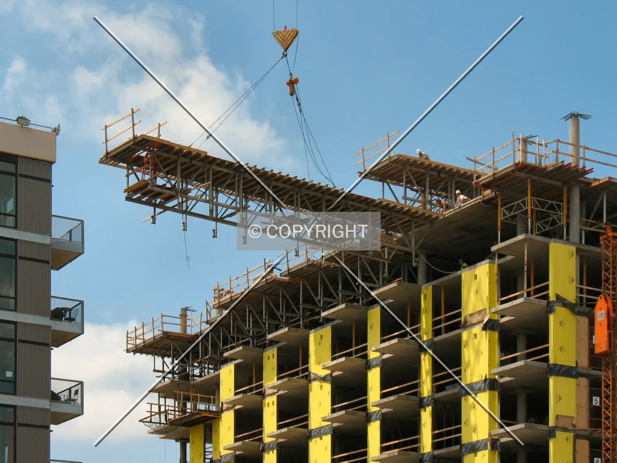 Tower crane removing scaffolding from support of the 9th floor