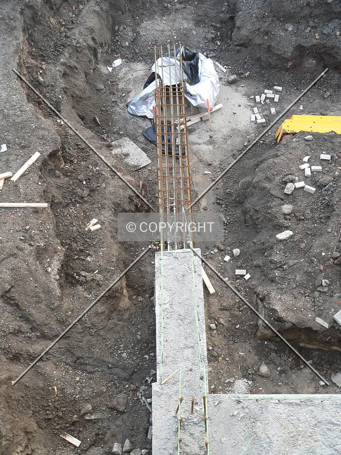 Caissons being connected with rebar and concrete to form the foundation